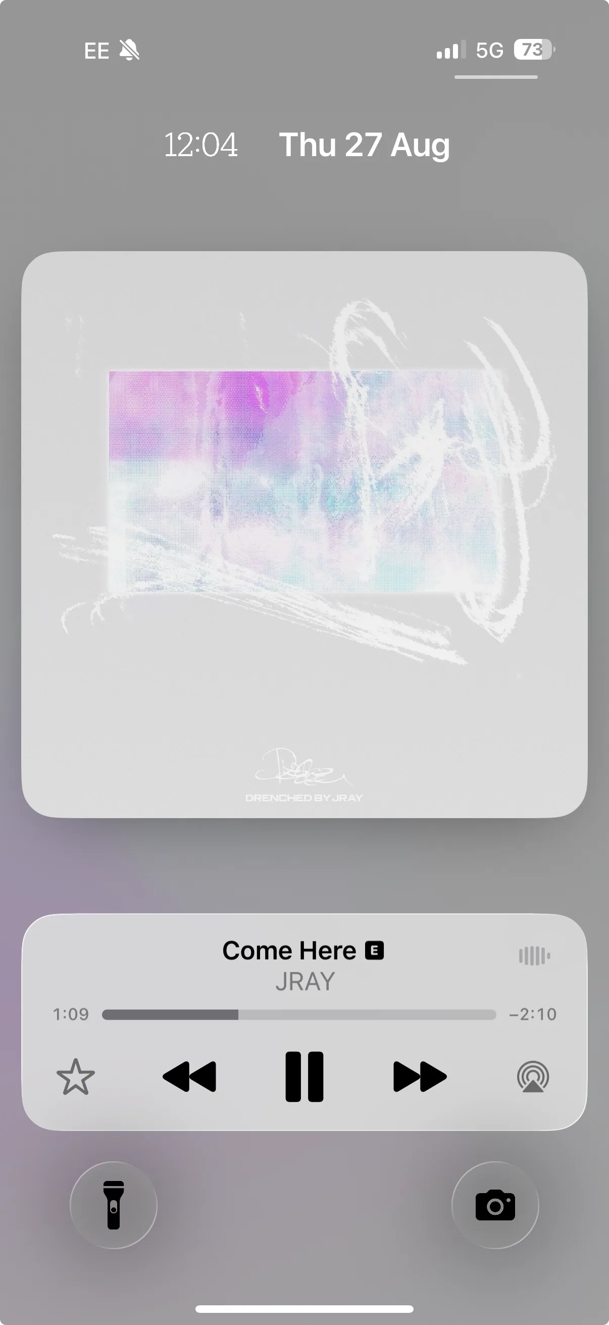 Drenched by JRAY playing, sleeve shown on a phone.